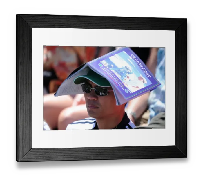 Framed Print : Tennis Fan Keeps Sun Off Head With Programme Framed Print : Tennis Fan Keeps Sun Off Head With Programme