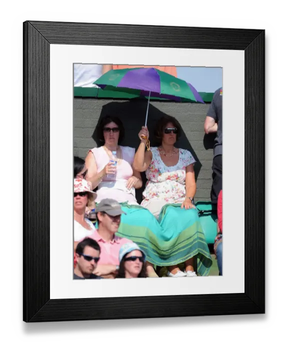 Framed Print : Tennis Fans Under Umbrella Framed Print : Tennis Fans Under Umbrella