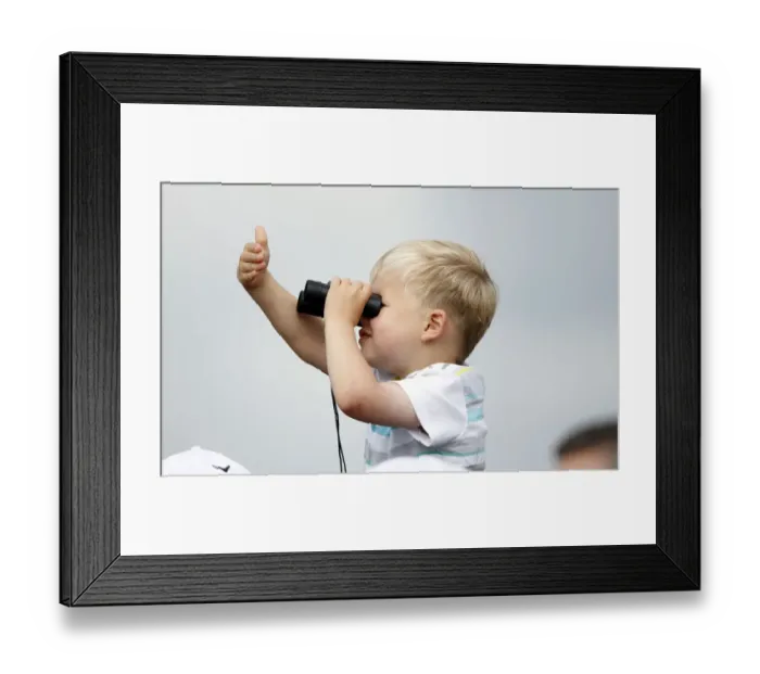 Framed Print : Young Spectator Tries Out Binoculars Framed Print : Young Spectator Tries Out Binoculars