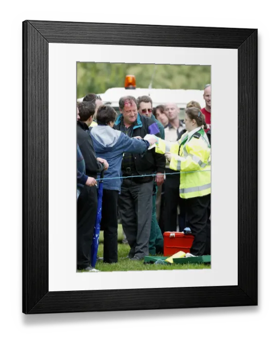 Framed Print : Spectator Is Treated After Struck By Golf Ball Framed Print : Spectator Is Treated After Struck By Golf Ball