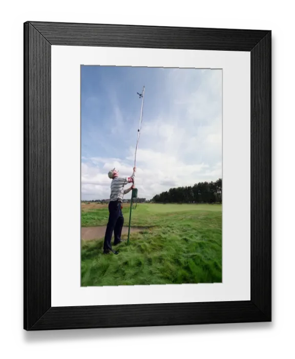 Framed Print : Measuring Wind Speed On Course Framed Print : Measuring Wind Speed On Course