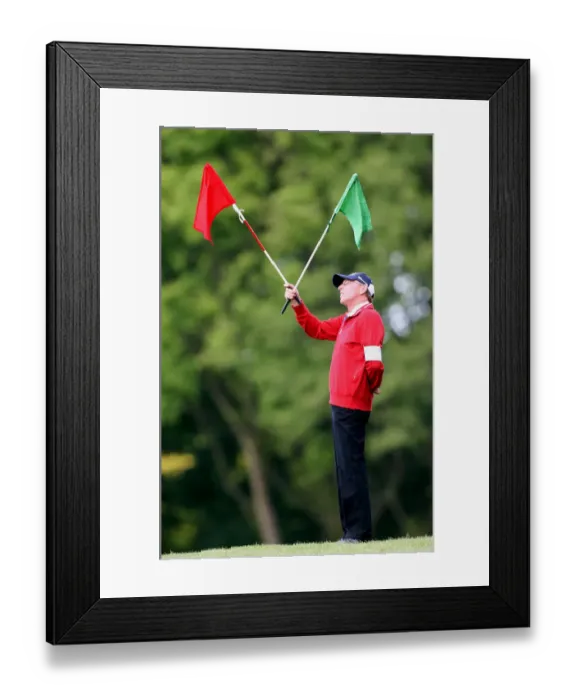 Framed Print : Golf Marshall With Flags Framed Print : Golf Marshall With Flags