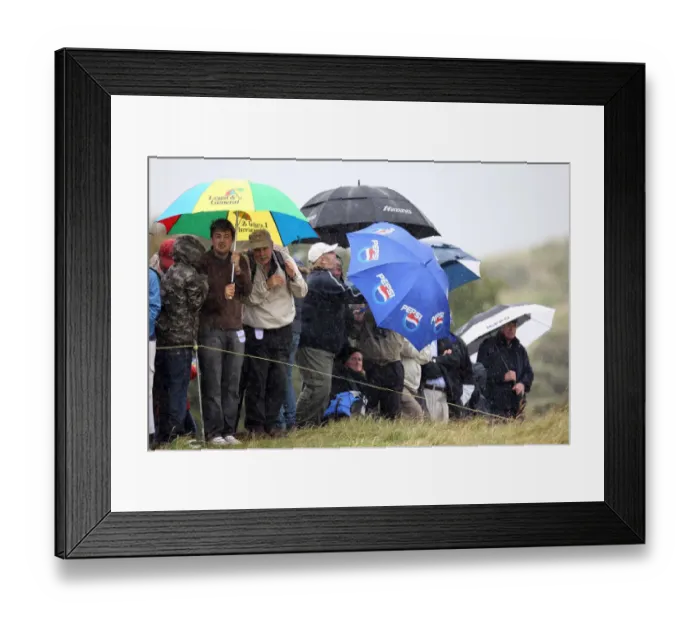 Framed Print : Spectators Cower In Driving Rain Framed Print : Spectators Cower In Driving Rain