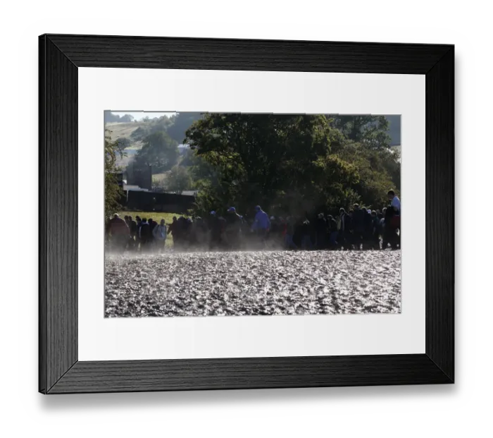 Framed Print : Spectators Walk Through Mud Framed Print : Spectators Walk Through Mud