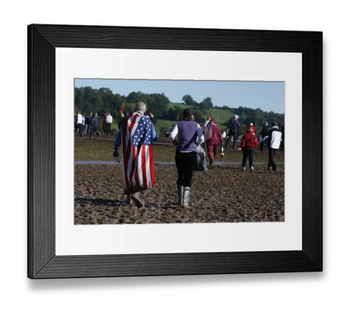 Framed Print : Spectators Walk Through Mud Framed Print : Spectators Walk Through Mud