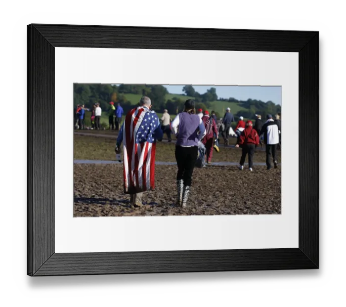 Framed Print : Spectators Walk Through Mud Framed Print : Spectators Walk Through Mud
