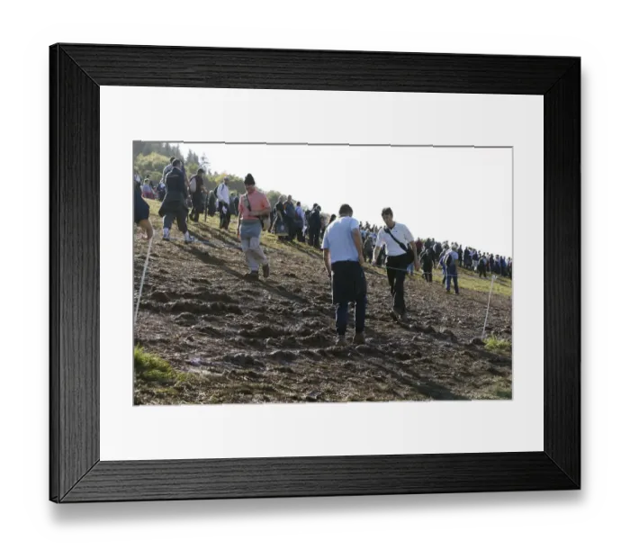 Framed Print : Spectators Walk Through Mud Framed Print : Spectators Walk Through Mud