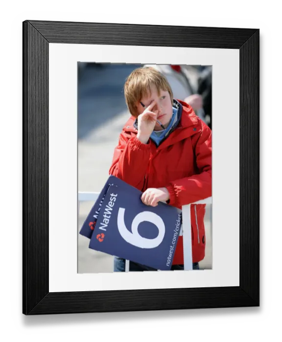 Framed Print : Sad Young Cricket Fan After Game Is Abandoned Framed Print : Sad Young Cricket Fan After Game Is Abandoned