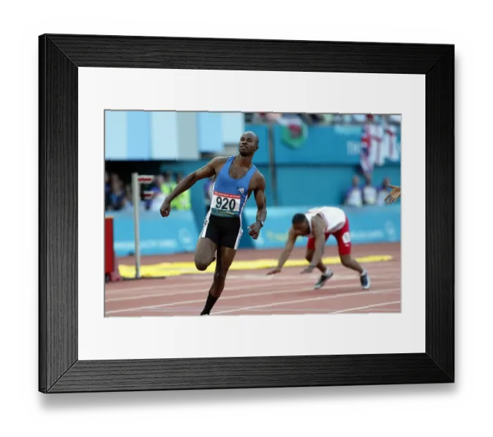 Framed Print : Kim Collins Wins 100 Metres