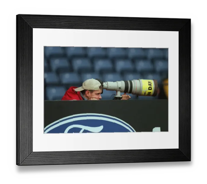 Framed Print : Photographer Waits For Action Framed Print : Photographer Waits For Action