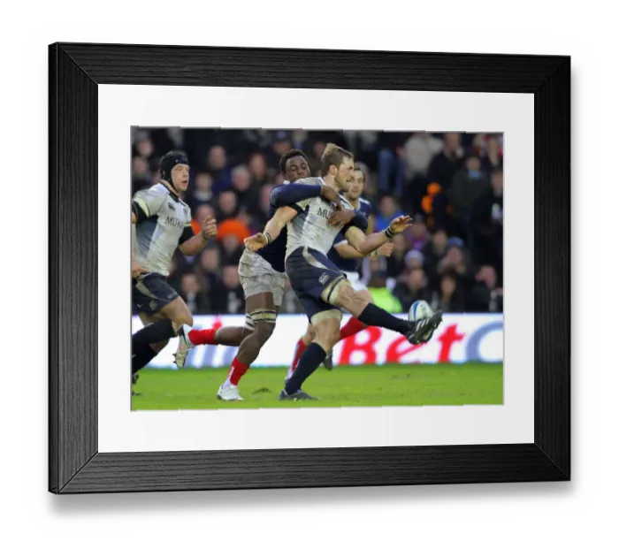 Framed Print : Fulgence Ouedraogo Challenges John Barclay As He Kicks Framed Print : Fulgence Ouedraogo Challenges John Barclay As He Kicks
