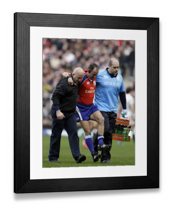 Framed Print : Referee Romaine Poite Limps Off Injured