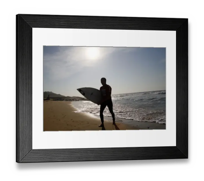 Framed Print : Silhouette Of Surfer Leaving Sea Framed Print : Silhouette Of Surfer Leaving Sea
