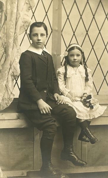 Two smartly dressed little children