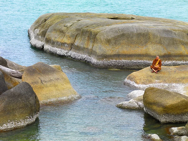 Thailand, Ko Samui, Monk resting on rocks