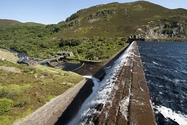 View of reservoir and dam overflow, Caban Coch Reservoir, Elan Valley, Powys, Wales, July