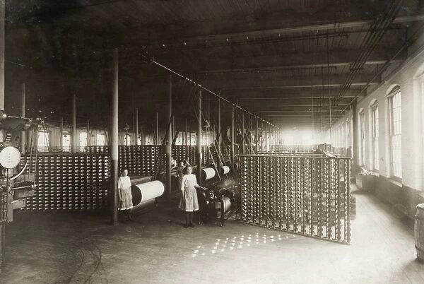 HINE: CHILD LABOR, 1912. Interior view of the large warping room with young workers