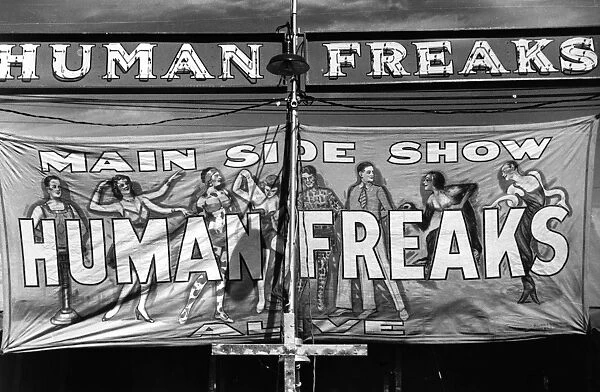 VERMONT: SIDESHOW, 1941. Banner advertising the main sideshow of Human Freaks at the Vermont State Fair in Rutland. Photograph by Jack Delano, September 1941