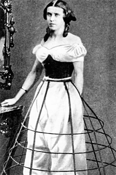 WOMENs FASHION, c1850. A young woman wearing crinolines and a metal hoop, c1850