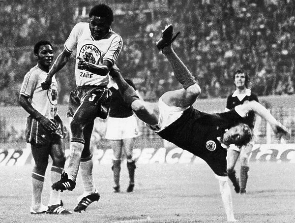 WORLD CUP, 1974. Denis Law of Scotland and the Zaire Leopards in the 1974 World Cup, held in West Germany