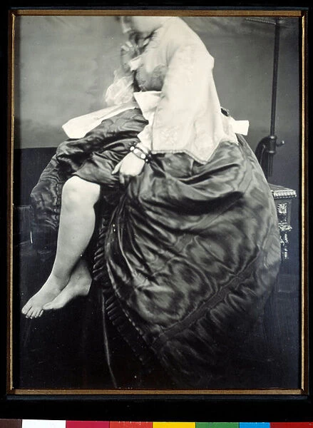 Countess Verasis de Castiglione nee Virginia Oldoini, sitting on a table