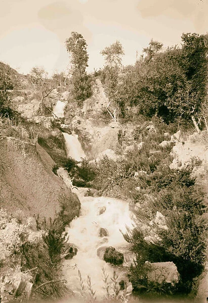 Stream flowing rocks plants 1898 Middle East