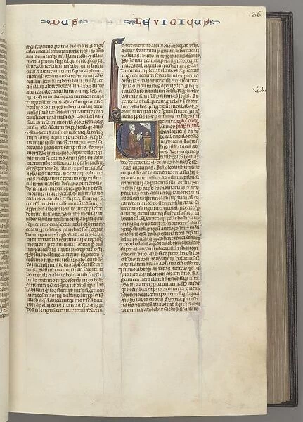 Fol. 36r, Leviticus, historiated initial V, Moses offering a sacrificial lamb on an altar, c
