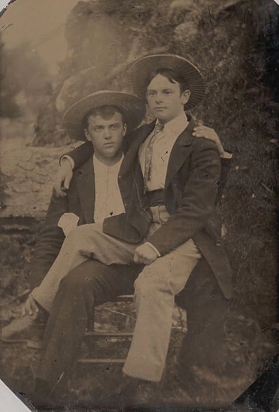 Two Young Men in Straw Hats, One Seated in the Others Lap, 1870s-80s. Creator: Unknown