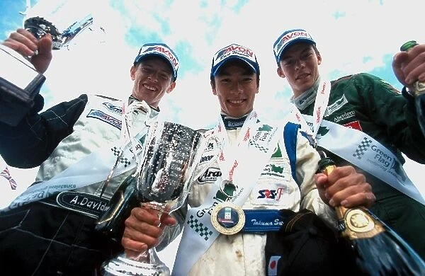British Formula Three Championship: The podium finishers for race two: Anthony Davidson second; Takuma Sato winner; Andre Lotterer third