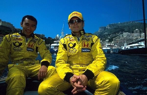 Formula One World Championship: DHL Jordan Honda drivers Takuma Sato and Giancarlo Fisichella relax on a yacht in the Monaco harbour