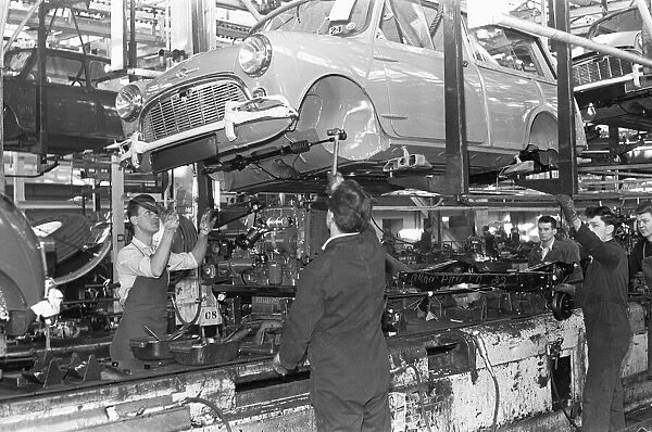 The front axel and engine seen here being mounted on to a Austin Mini on the production