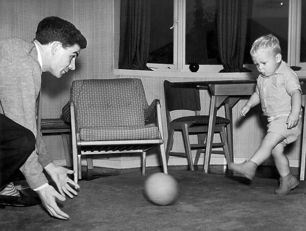 Birmingham City footballer Eddie Brown pictured at home in Sheldon playing with his two