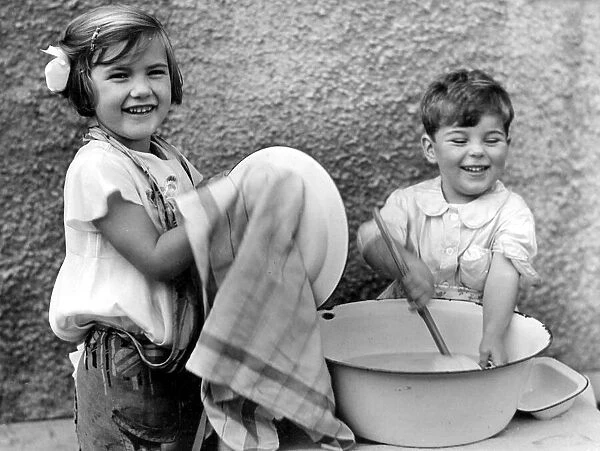 Two children washing up. c. 1945 P044496