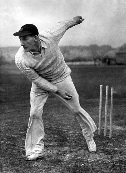 Derbyshire county cricketer George Pope bowling. April 1947 P008173