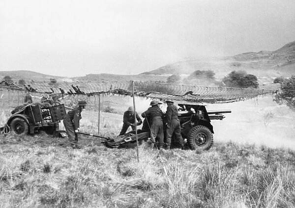 A Field Regiment of the Royal Artillery training in the Welsh hills with 25-pounder field