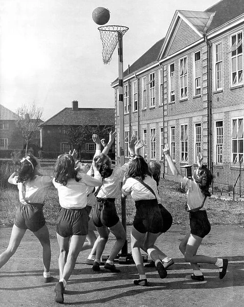 Girls of Malmsbury Secondary School in Morden, Surrey playing a game of netball during P