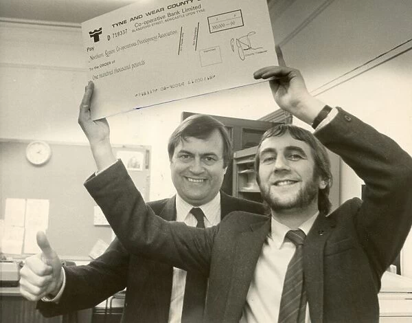 John Prescott hands over a cheques from Tyne Wear County Council to Norman Watson of