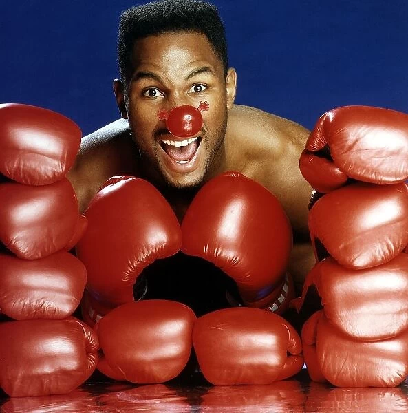 Lennox Lewis Heavyweight Boxer poses for Red Nose Day. March 1991