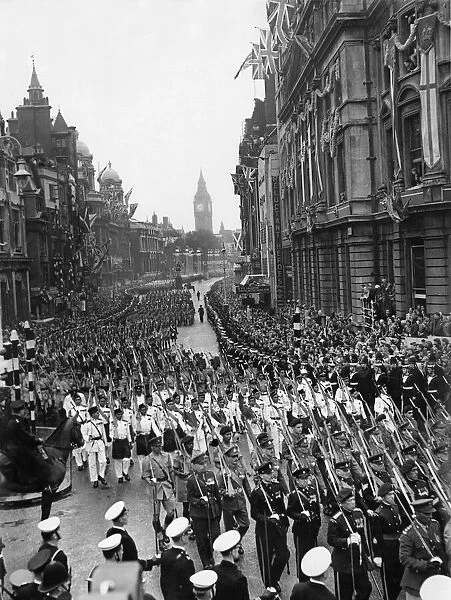 Members of overseas armed services march along Whitehall leading the coronation