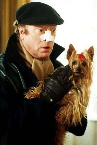 Michael Caine Film Actor in the new film Bullseye with his dog Ocotber 1989