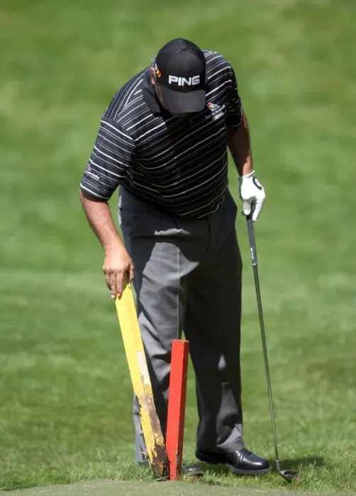 Framed Print : Angel Cabrera Removes Stakes On 7th Hole Framed Print : Angel Cabrera Removes Stakes On 7th Hole