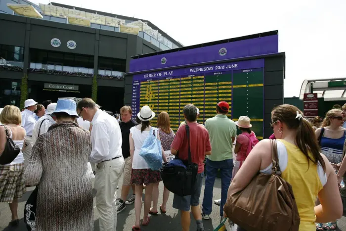 Framed Print : Fans Looking At Order Of Play Framed Print : Fans Looking At Order Of Play
