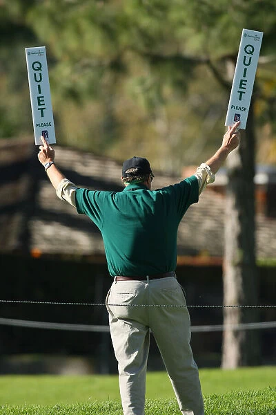 Golf Marshal Holds Quite Signs