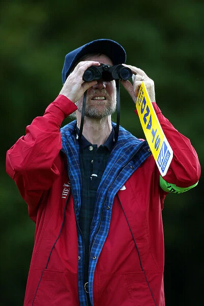 Golf Marshall With Binoculars