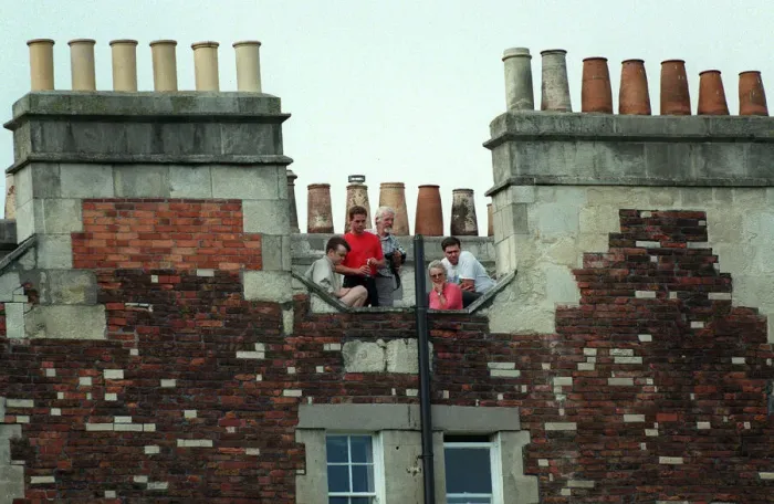 Framed Print : Roof-Top Spectators Framed Print : Roof-Top Spectators
