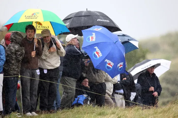 Framed Print : Spectators Cower In Driving Rain Framed Print : Spectators Cower In Driving Rain