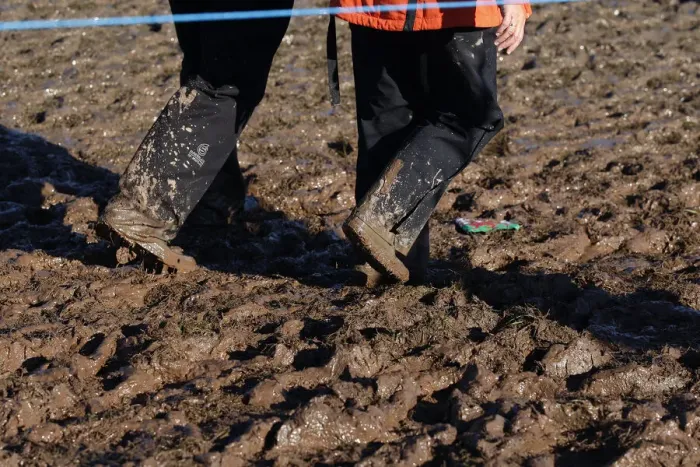 Framed Print : Spectators Wade Through Mud Framed Print : Spectators Wade Through Mud