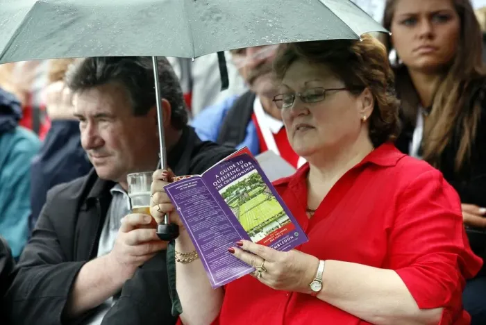 Framed Print : Tennis Fans In Rain Framed Print : Tennis Fans In Rain