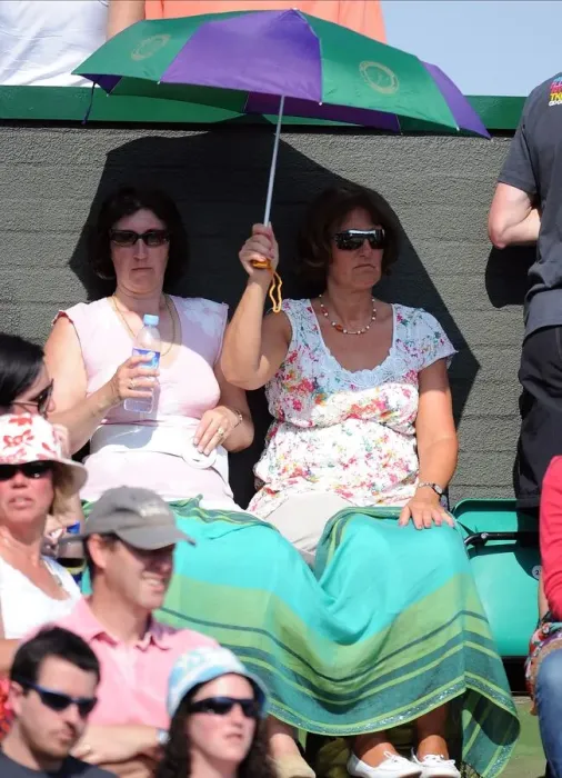 Framed Print : Tennis Fans Under Umbrella Framed Print : Tennis Fans Under Umbrella