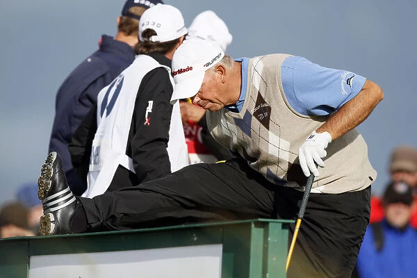 Tom Lehman Stretches On The 18th Tee